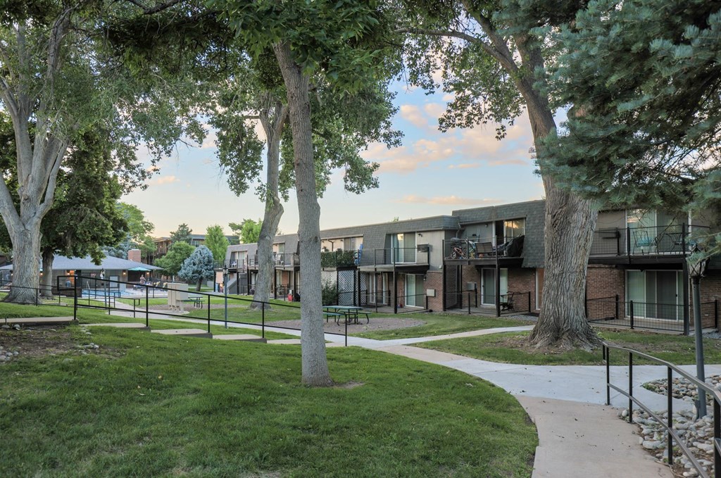 our apartments are located in a park with trees and pathways