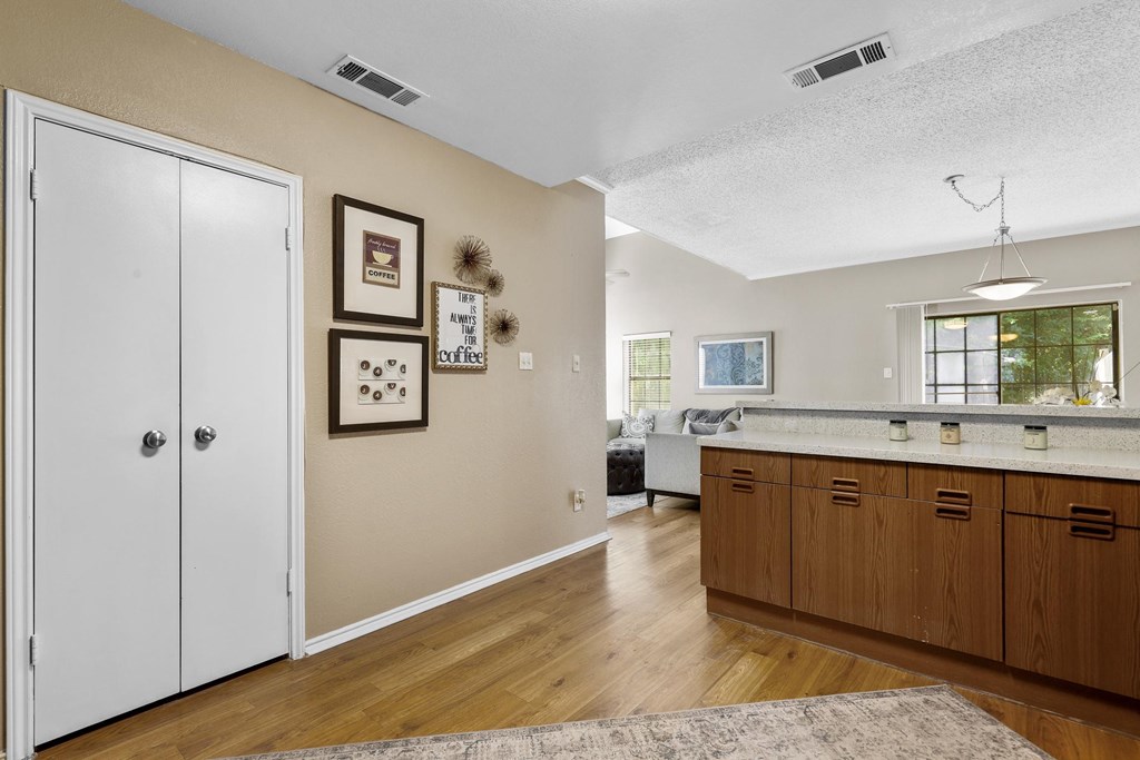 Hallway with photos on wall