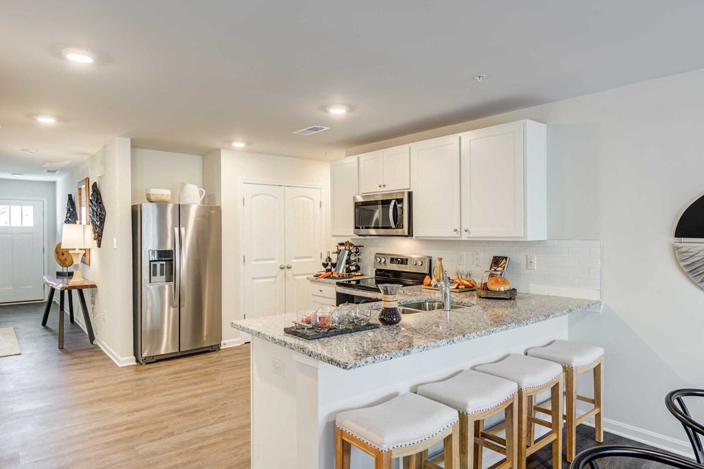 a kitchen with a marble counter top