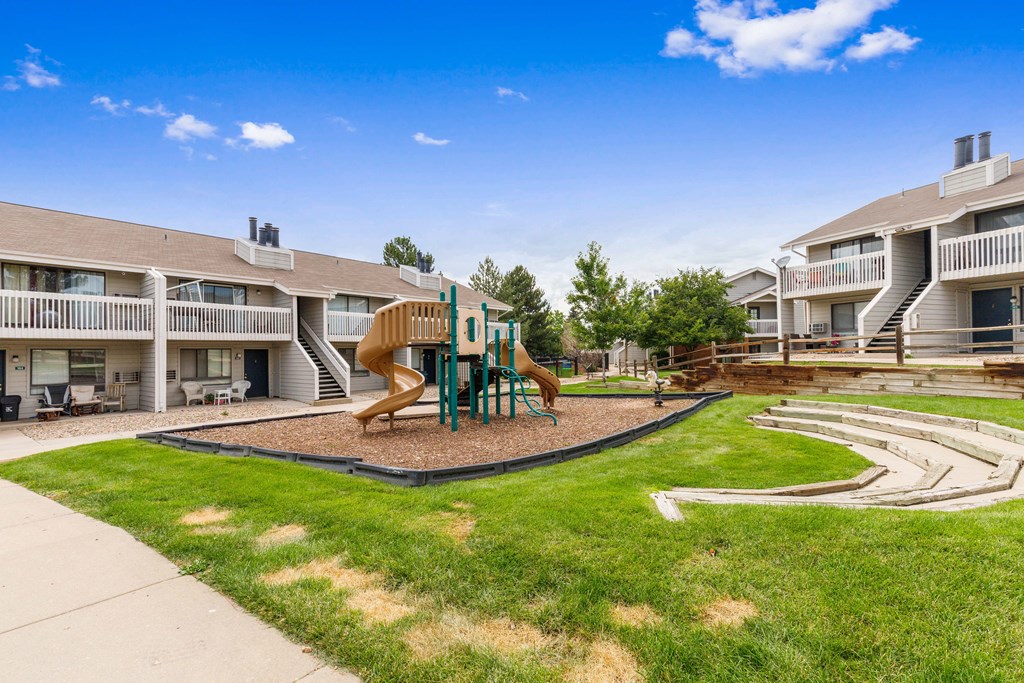 the preserve at ballantyne commons park with playground and apartment buildings