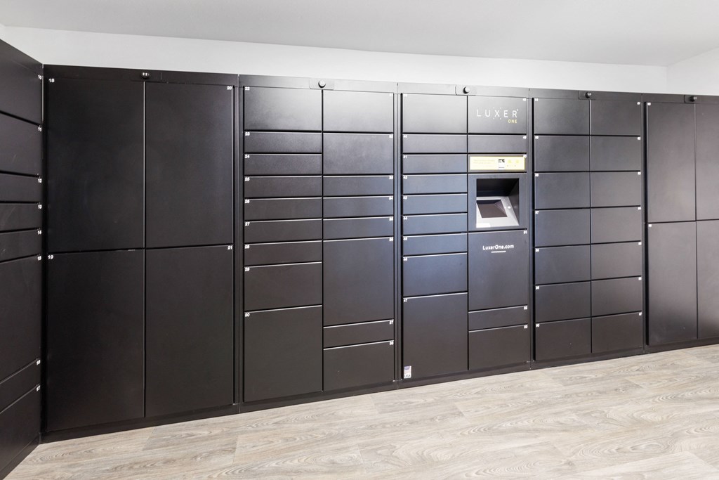 a group of lockers in a room with a wood floor