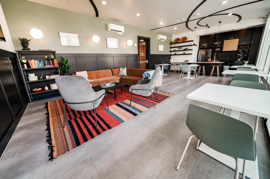 a living room with couches chairs and a table