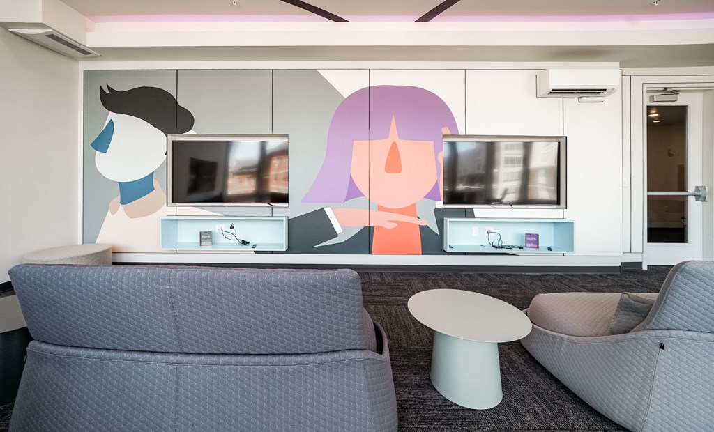 a living room with a couch and a table and a television