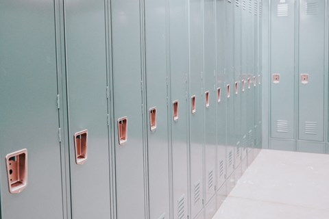 a row of blue lockers in a room