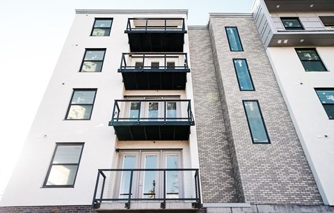 a building with three balconies on the side of it