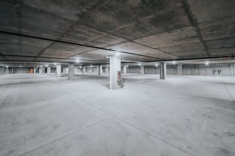 the empty parking garage of an apartment building