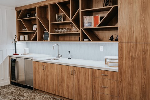 a kitchen with wooden cabinets and a white counter top