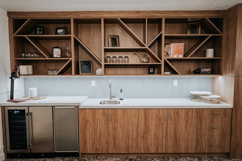 a kitchen with wooden cabinets and a white counter top