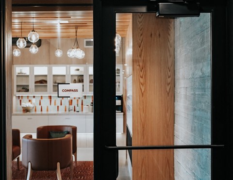 a view of a lobby from behind a glass door