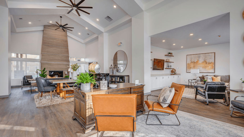 A living room with a wooden floor and furniture.