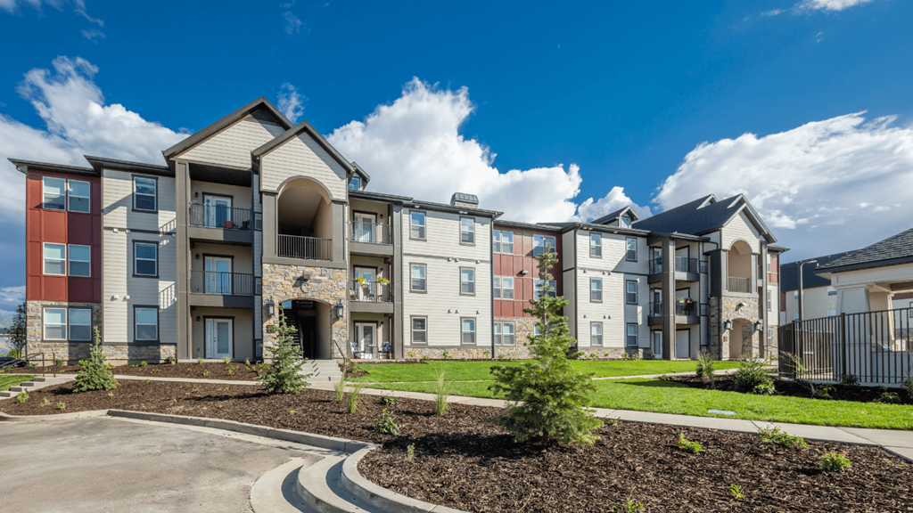 Apartment complex with a mix of modern and traditional architecture.
