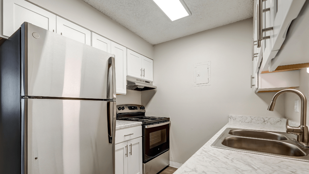 the preserve at ballantyne commons apartment kitchen with refrigerator sink and stove