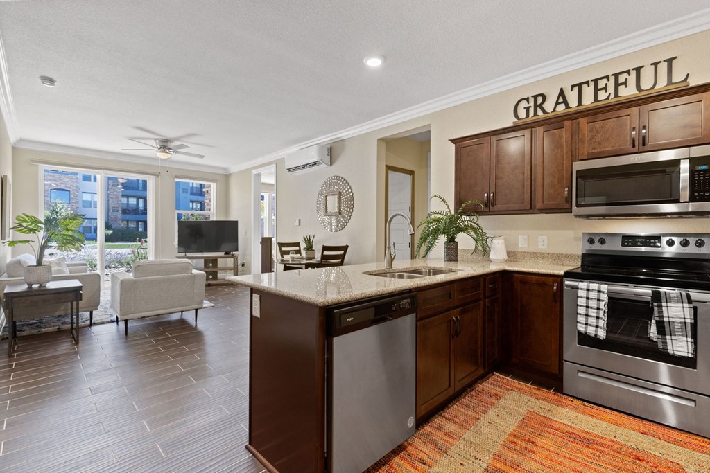 a kitchen and living room with a counter top