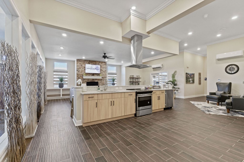 a kitchen with an island and a living room with a couch