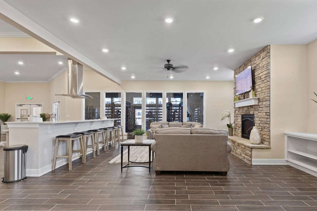 the preserve at gateway living room with fireplace and bar