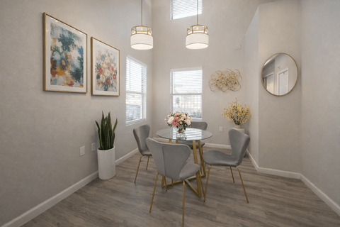 A dining room with a table set for four.