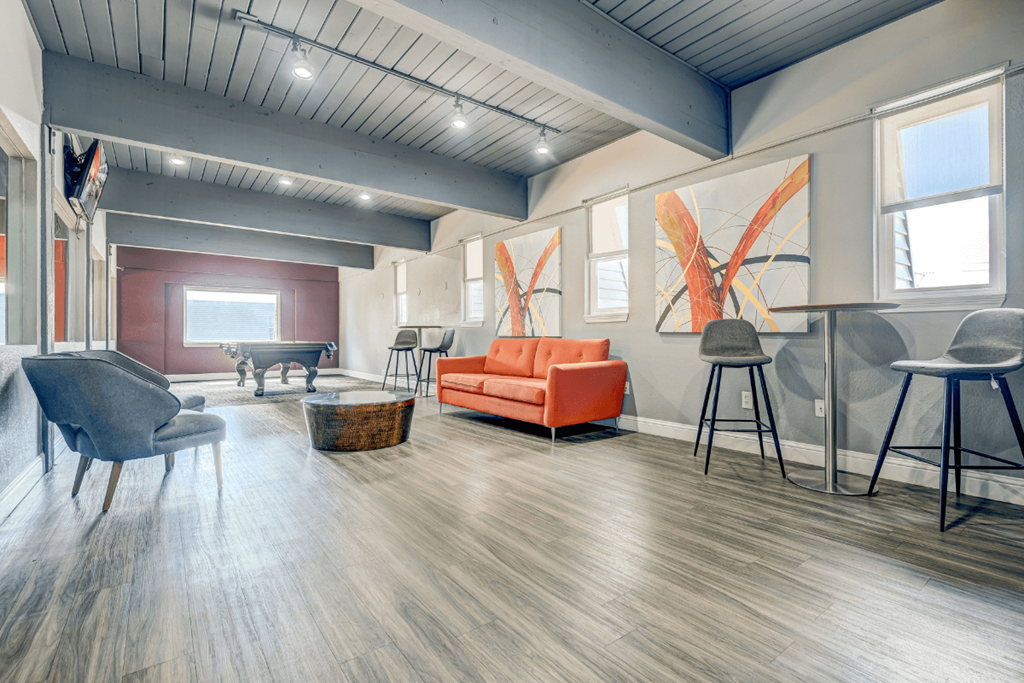 the preserve at ballantyne commons community room with furniture and a piano