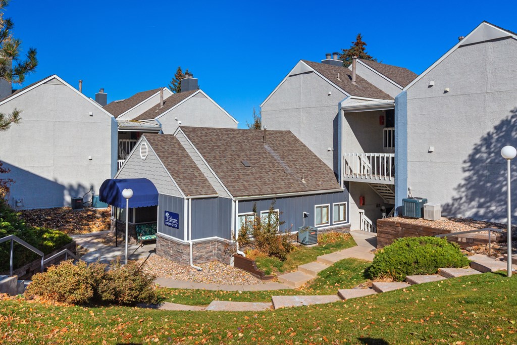 an aerial view of a group of houses with a yard