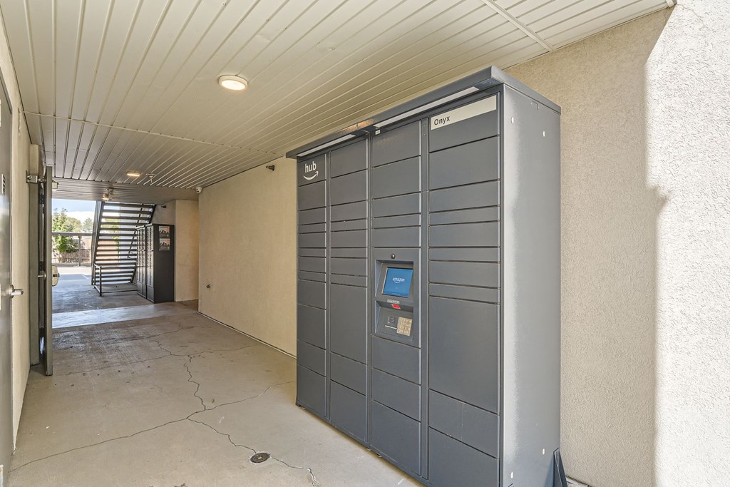 the front door of an apartment building with a locking door