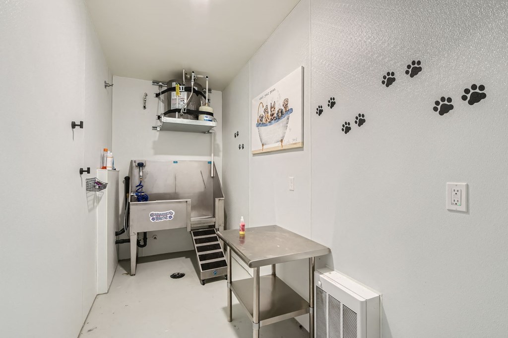 a small kitchen with a table and a sink