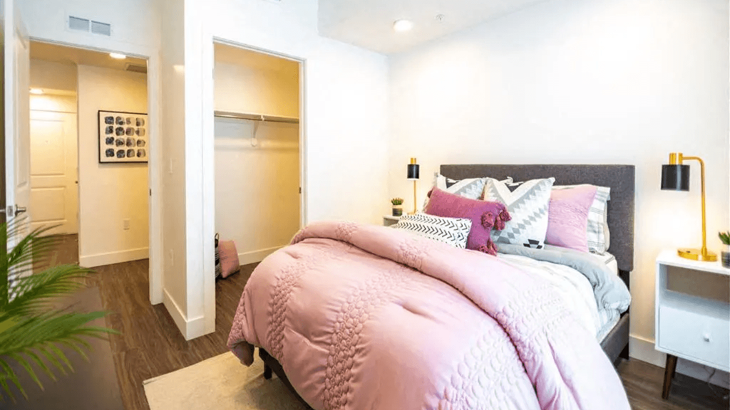 a bedroom with a bed and a closet