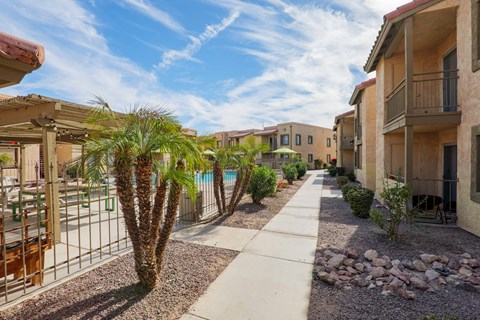 A sunny day at a residential area with a clear blue sky.