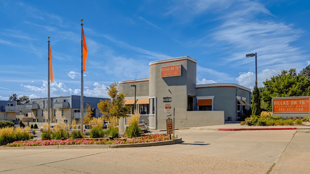 a building with two flags in front of it