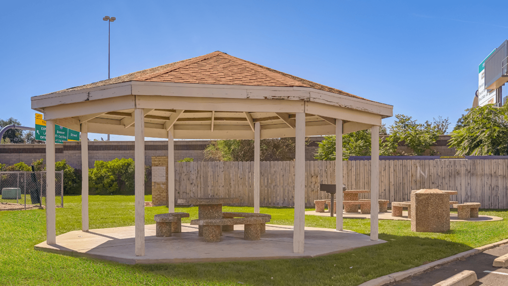 a park with a gazebo and benches