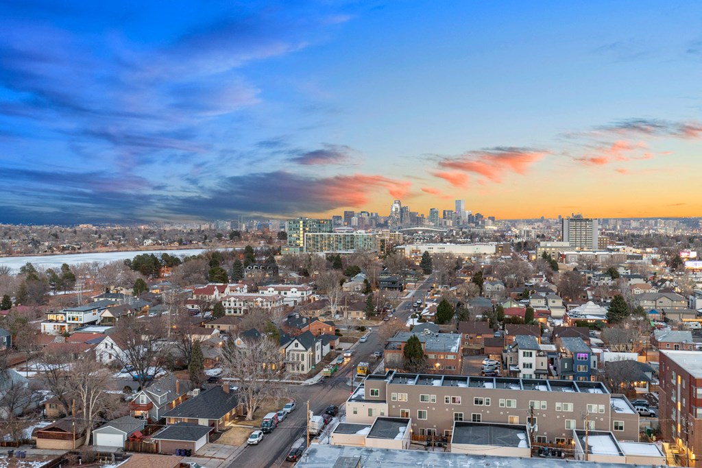 an aerial view of the city at sunset