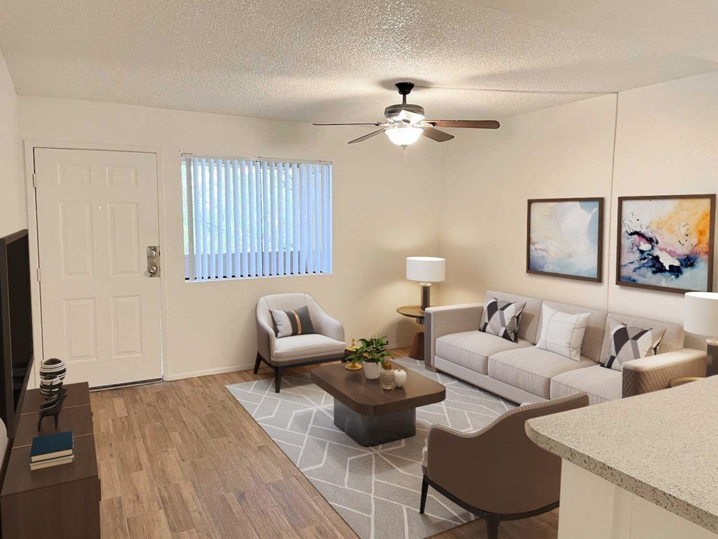 A living room with a couch, chair, and a coffee table.