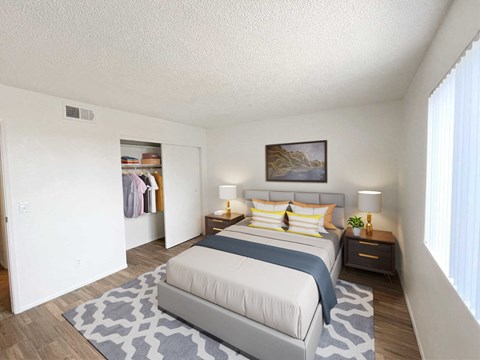 A bedroom with a large bed and a painting on the wall.