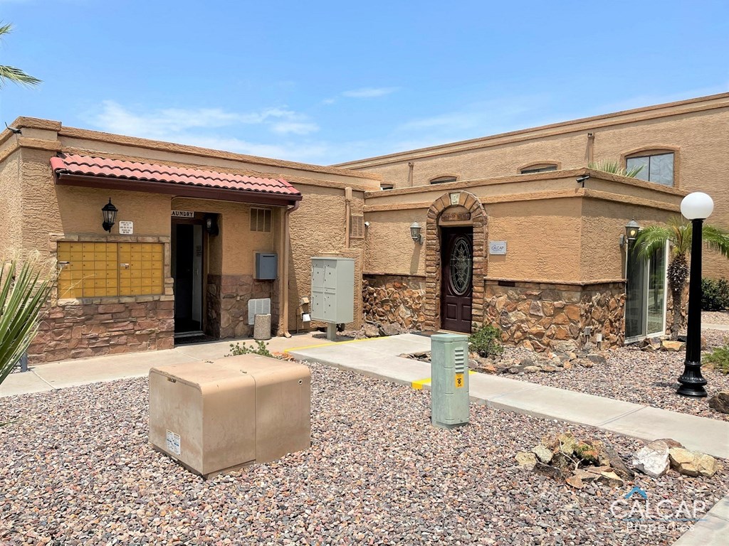 A house with a brown door and a brown wall.