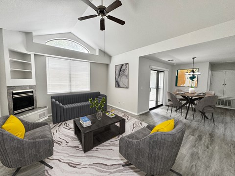 A living room with grey couches and a coffee table.
