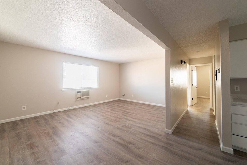 A room with a window and a door.