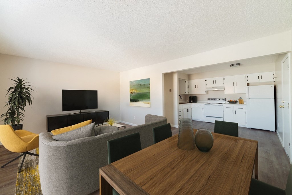 A modern living room with a yellow chair and a grey sofa.