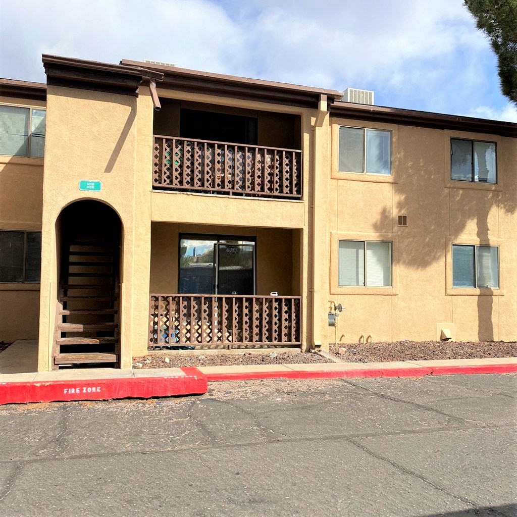 A building with a red line on the ground in front of it.