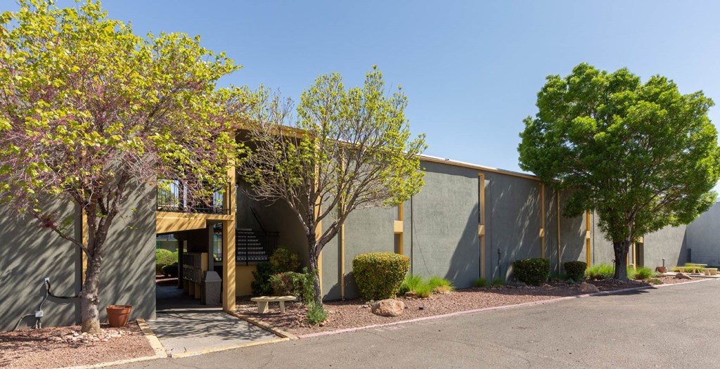 A building with a green wall and a yellow door.