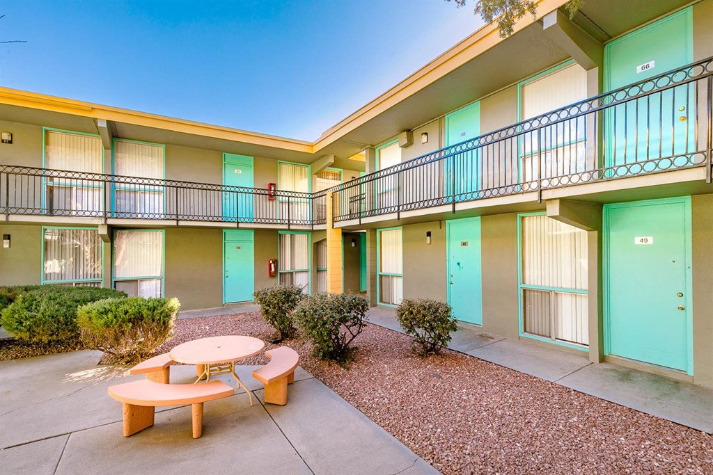 A sunny day at a residential complex with a blue sky.