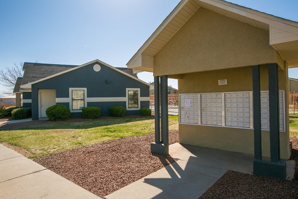 A small building with a blue house in front of it.