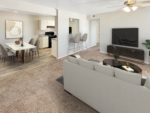 A living room with a grey couch and a television.