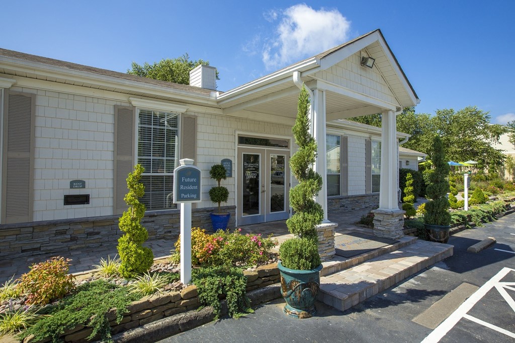 A white building with a sign that says "Finance" in front of it.