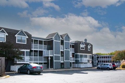 A car is parked in front of a building.