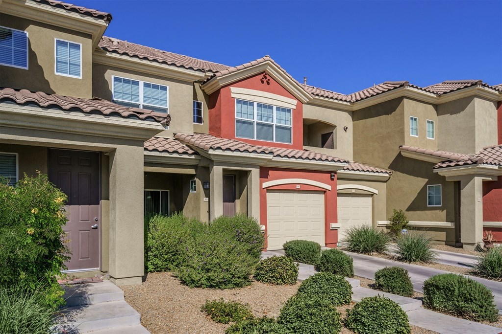 A row of houses with brown and tan exteriors.