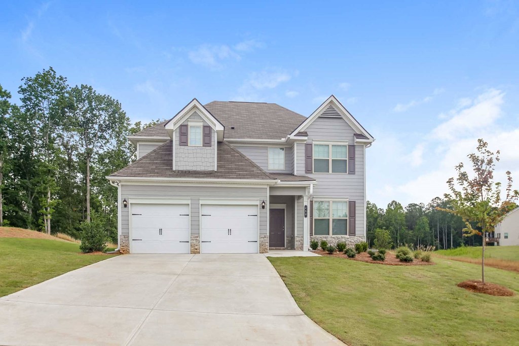 a house with a driveway and a garage door