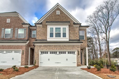 a large brick house with a two car garage