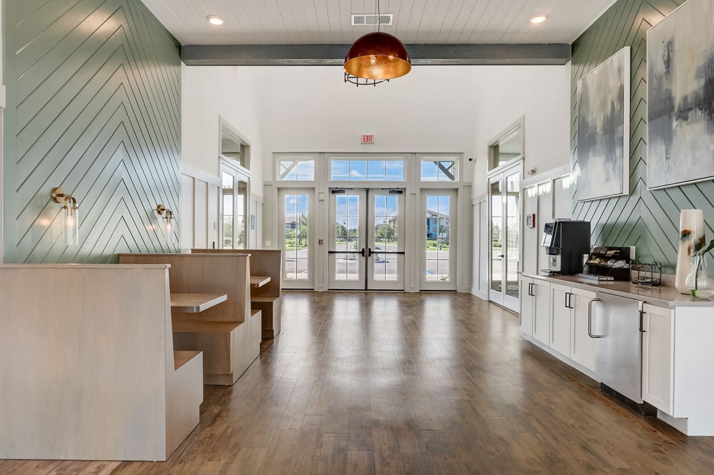 a large room with a counter and a door to a lobby