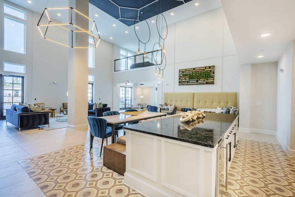 a kitchen with a large island and a dining room table