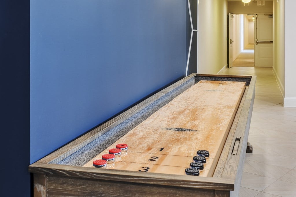 a foosball table in a blue walled game room with a blue walls