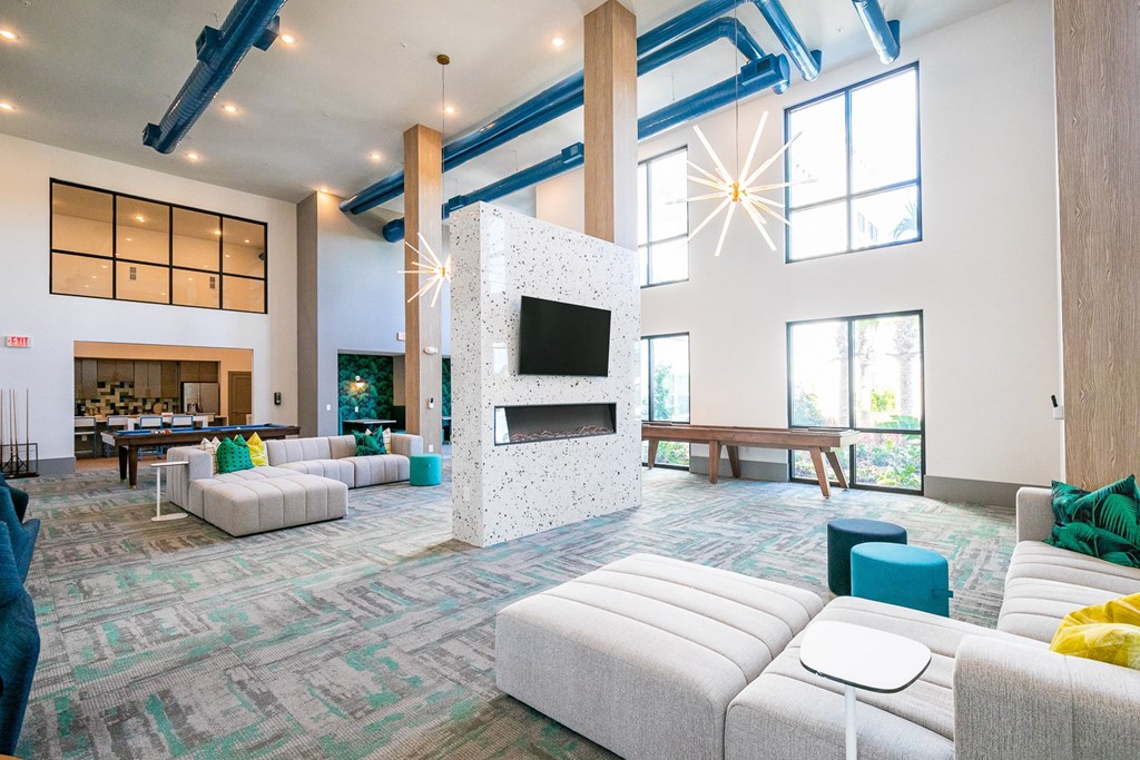 the preserve at gateway living room with couches and a fireplace