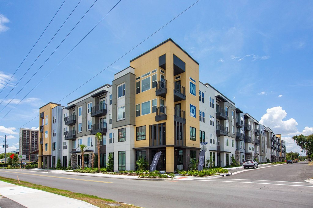 a street view of an apartment building on a city street